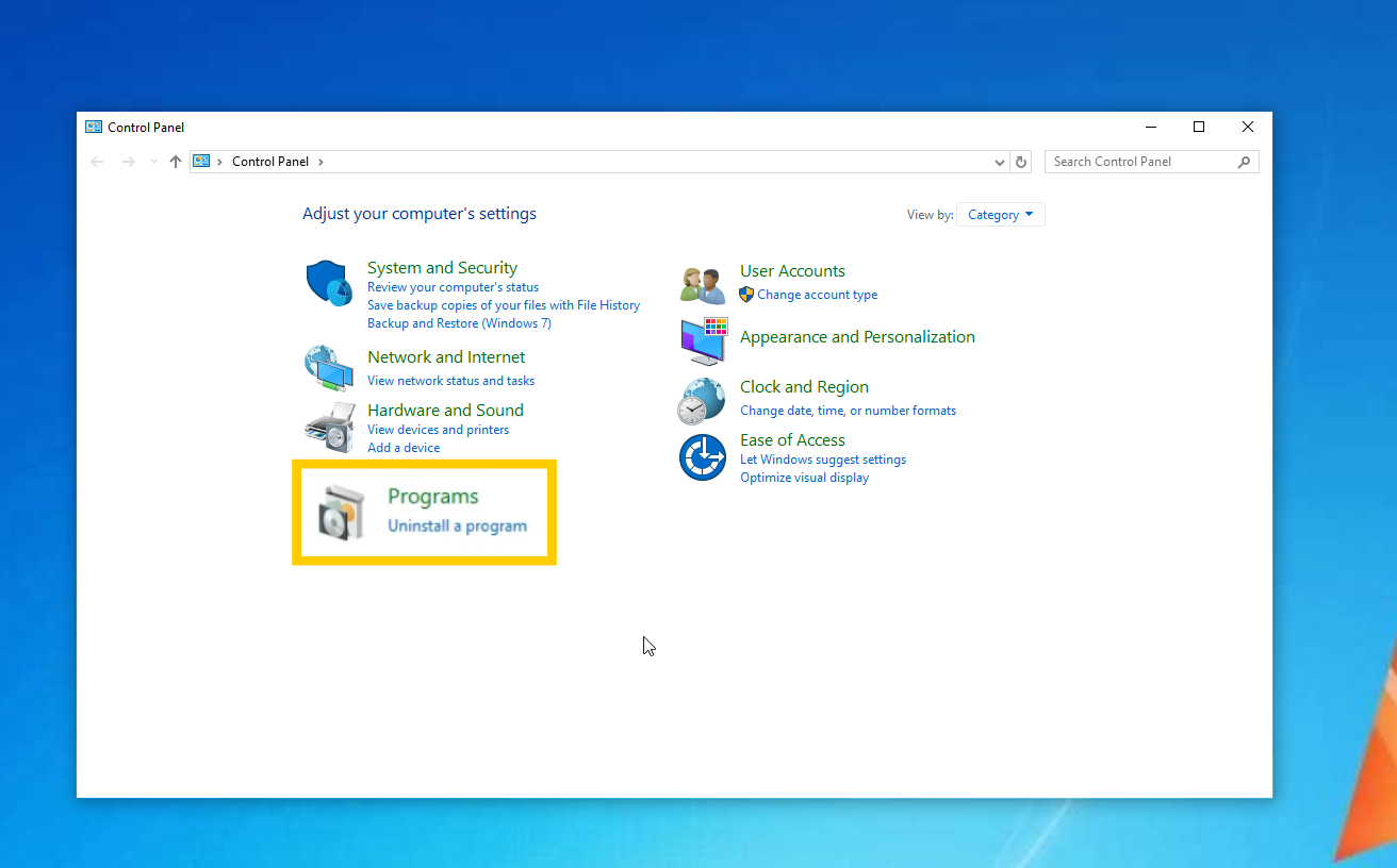 Windows 10 Control Panel showing the "Programs" setting highlighted.