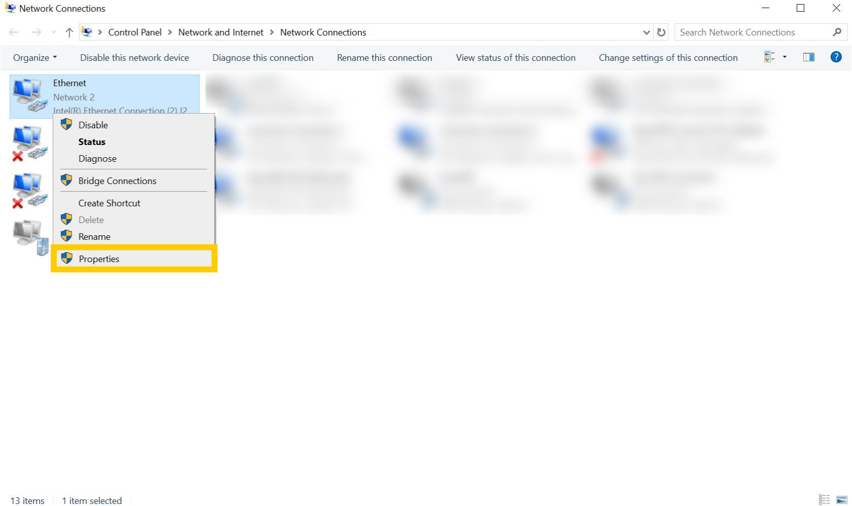 Network Connections page on Windows 10. An ethernet connection is selected and the "Properties" option is highlighted.
