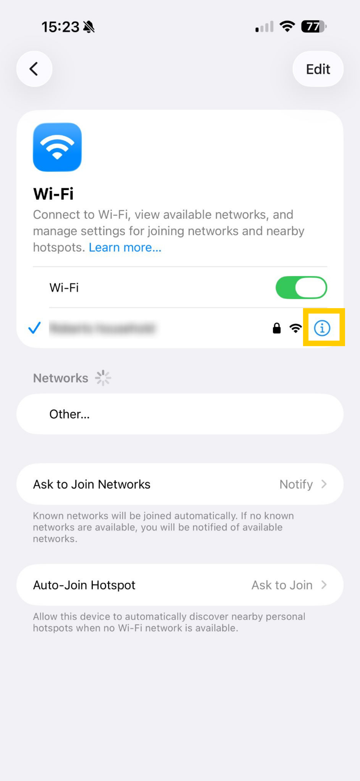 iOS Wi-Fi settings showing information icon icon highlighted next to connected network.