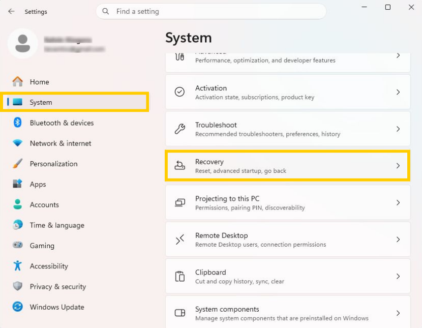 The Windows Settings window with the "system" and "recovery" options highlighted